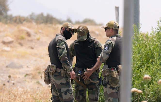 Des forces de l’ordre kurdes sécurisent le site de la grotte de Casene, où des combattants du PKK doivent déposer les armes, dans le gouvernorat de Souleimaniyé, dans le nord de l’Irak, le 11 juillet 2025.